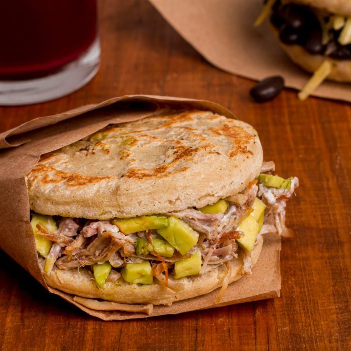 delicious-arepa-with-filling-wraped-paper